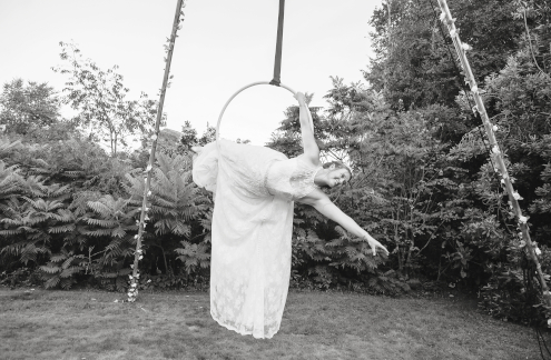 Lisa Truscott doing aerial hoop in her wedding dress.