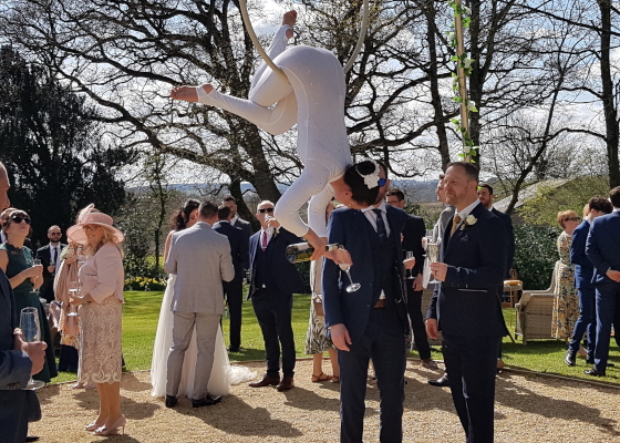 The 2 Lisa's, pouring drinks from above for your wedding guests.