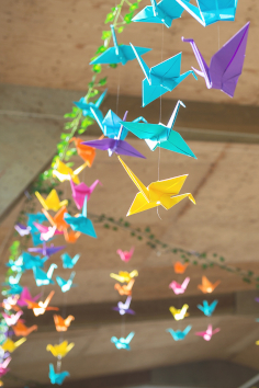 Hanging colourful orgigami cranes.